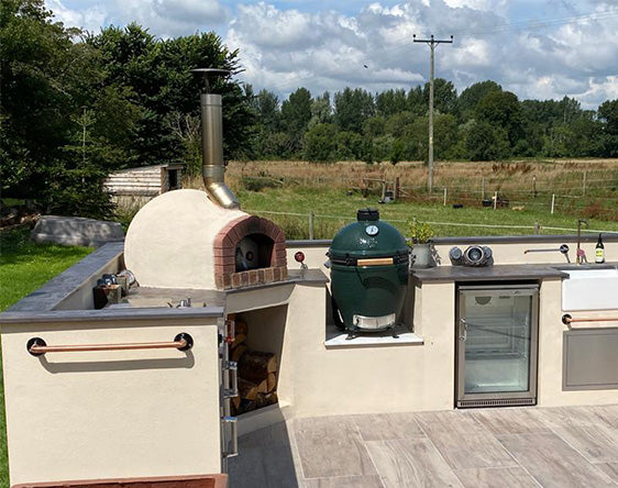 outdoor kitchen with built in pizza oven
