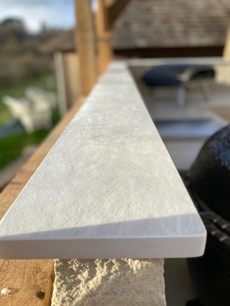 Dekton liquid shell upstands on outdoor kitchen in Hampshire.