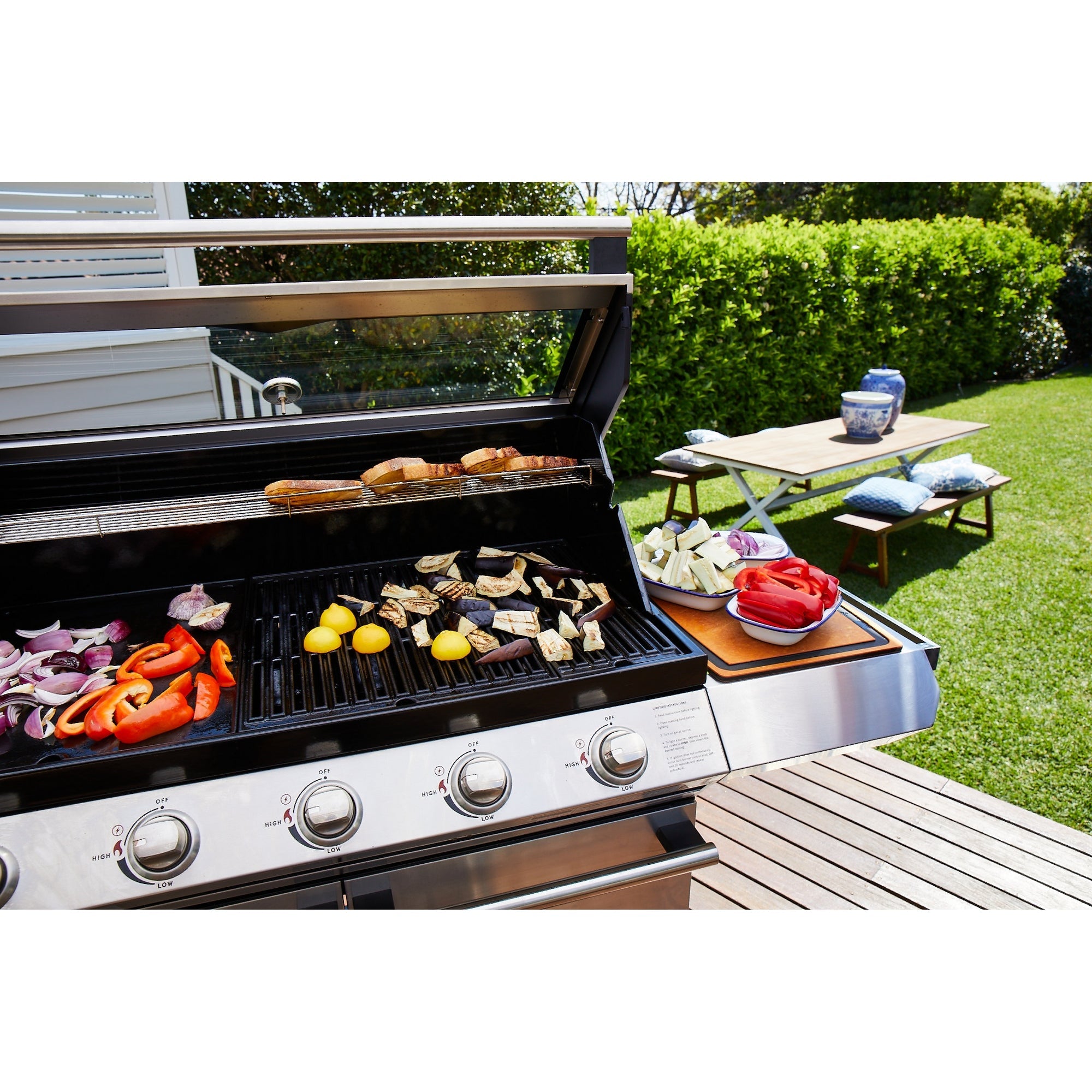 free standing gas bbq, with food on the grill 
