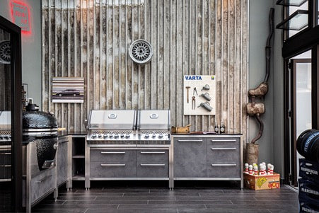 L- shaped Smoke coloured Burnout kitchen with stainless steel frame